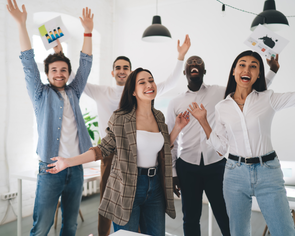 Group,Of,Happy,Multiethnic,Employees,Screaming,Dancing,And,Raising,Arms